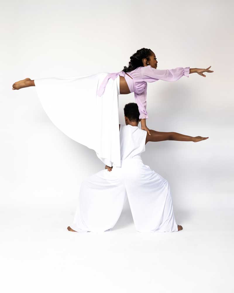 Dance ELITE liturgical duet lifting through a flowing white skirt