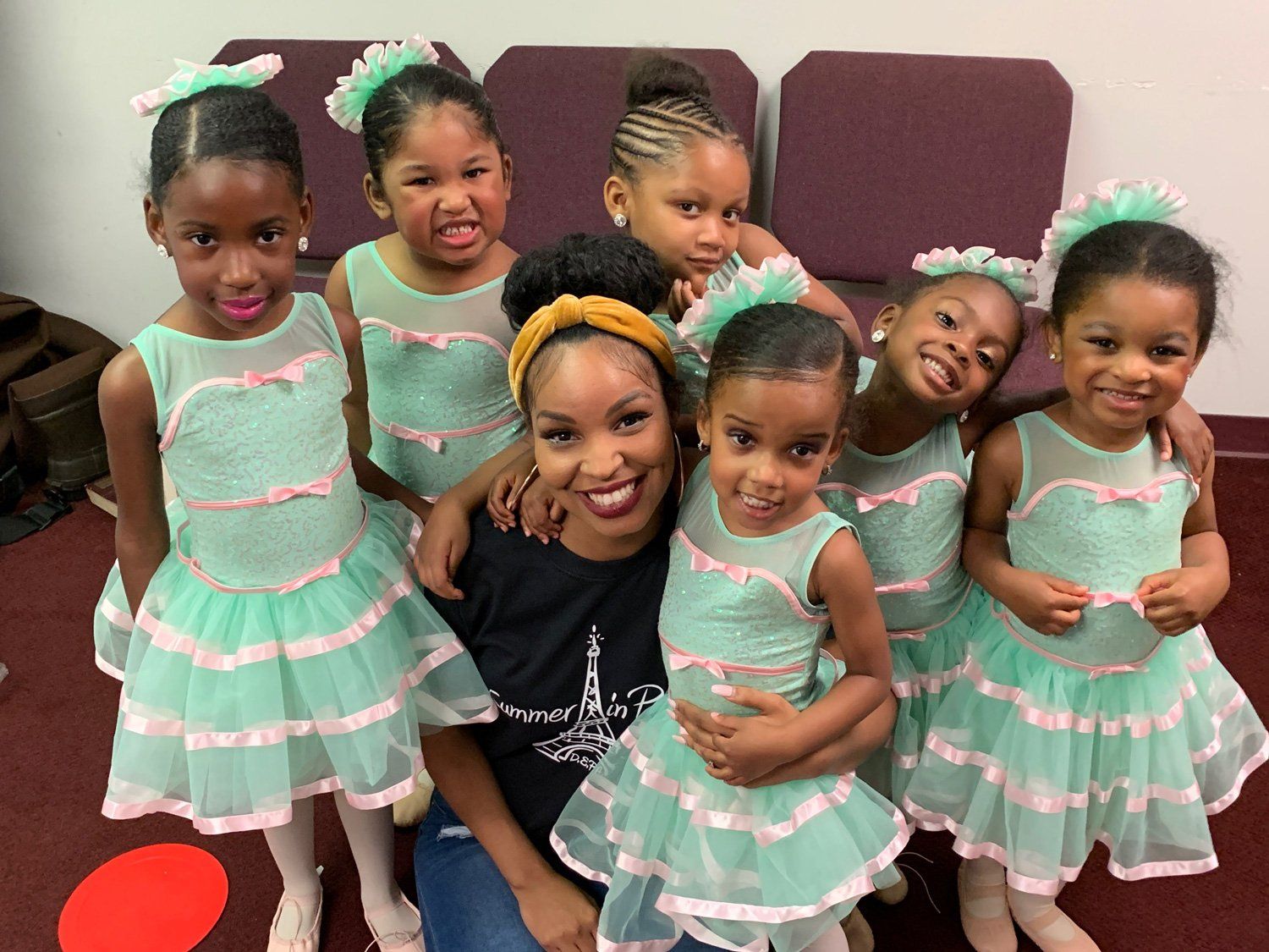 Samara Tillman, founder and artistic director, with young Dance ELITE dancers